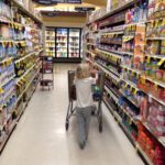 Kid pushing a shopping cart